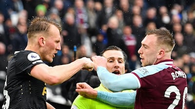 Newcastle United defender Dan Burn, left, and West Ham United's Jarrod Bowen argue. AFP