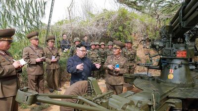 This undated picture released from North Korea’s official Korean central news Agency on May 5, 2017, shows North Korean leader Kim Jong-un (C) inspecting the defence detachment on Jangjae Islet and the Hero Defence Detachment on Mu Islet located in the southernmost part of the waters off the southwest front. AFP / KCNA via KNS”