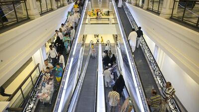 Shoppers push carts loaded with goods bought during their visit to Carrefour on its opening day at the brand new shopping centre Deerfields Townsquare on Sheikh Zayed Road in Al Bahia, near Abu Dhabi. Silvia Razgova / The National