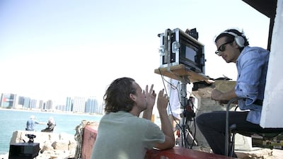 Ali Mostafa, right, with director of photography Michel Dierickx while shooting From A to B in Abu Dhabi. Silvia Razgova / The National