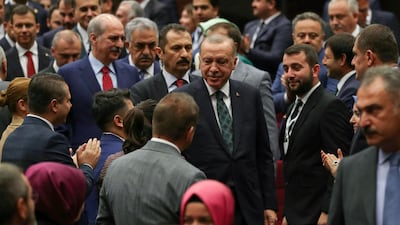 Turkish President Recep Tayyip Erdogan (C) attends the extended meeting with provincial heads of ruling Justice and Development (AK) Party in Ankara, Turkey, on October 10, 2019. / AFP / Adem ALTAN