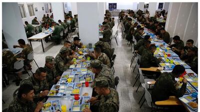 Members of the Palestinian National Security Forces having iftar in the dining hall at a base in the West Bank of Jericho June 14, 2016. Photo by Ammar Awad