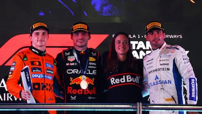Race winner Max Verstappen, second left, alongside second-placed Oscar Piastri, left, and McLaren's Carlos Sainz, right, who was third. Getty Images
