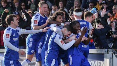 Isaac Buckley-Ricketts celebrates with teammates after scoring Macclesfield's second goal in their FA Cup third round win over Crystal Palace. AFP