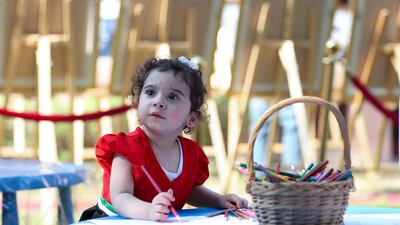 Marsa Mansour, 2, wearing her National Day dress at the Heritage Village in Abu Dhabi. Khushnum Bhandari / The National