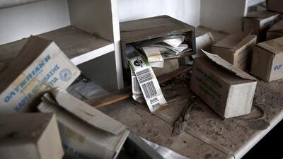 Athens’ Hellinikon airport, ignored for almost a decade, was sold to the Lamda consortium for €915 million. Above, Olympic Airways travel tag behind a desk inside the west terminal of the former airport. Yorgos Karahalis / Reuters