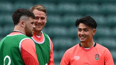 England fly-half Marcus Smith, right, during a team training session at Twickenham. AFP
