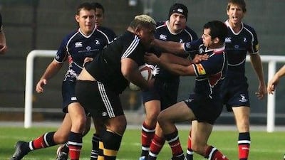 Trevor Leota of the Dubai Wasps finds his path blocked by Taif Al Delamie of the Jebel Ali Dragons. Al Delamie's own trials in his application to the International Rugby Board to play for the UAE national team has left him in limbo.