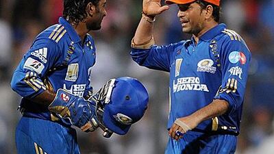 Sachin Tendulkar, right, and Ambati Rayudu celebrate Mumbai's victory against Kings XI Punjab.