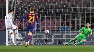 14) Ronaldo scores a penalty during the Champions League match against Barcelona at Camp Nou on December 8. AFP