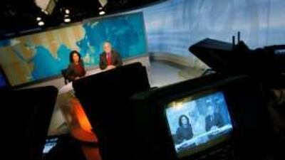 Washington-based Al Jazeera anchors Ghida Fakhry (L) and Dave Marash; the Gulf-based news service is making inroads in the US.