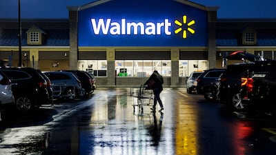 A shopper pushes a cart through the car park of a Walmart in Wilmington, Delaware. AFP