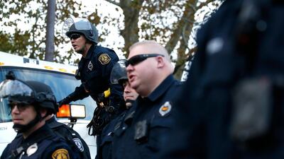 Pittsburgh police stand guard in riot gear near the Tree of Life synagogue. EPA