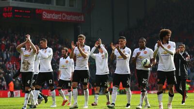 Manchester United players celebrate victory over Liverpool at Anfield on Sunday in the Premier League. Alex Livesey / Getty Images