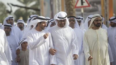Sheikh Mohammed bin Zayed speaks with Sheikh Hamdan during the national parade from Al Manhal Palace to Qasr Al Hosn fort. Seen with other dignitaries. Christopher Pike / Crown Prince Court - Abu Dhabi