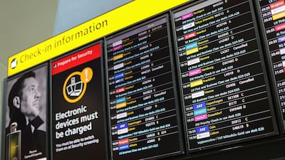 A check-in information board at Heathrow Airport displays details of cancelled flights on July 30. Reuters