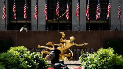 The Prometheus statue at Rockefeller Centre in Manhattan, New York City, is seen adorned with a face mask. Reuters