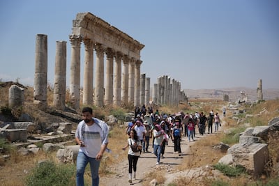 Tourism students and daytrippers visit the ruins of the ancient city of Apamea in the Hama countryside. AFP
