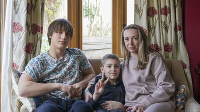 Ukrainian refugees Yaroslav Kryvoshyia and Irina Kryvoviaz, with her son Sasha as they settle into their new home in North Moreton, Oxfordshire. PA
