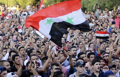 Syria's football fans had something to celebrate about after their team qualified for the World Cup play-offs. Louai Beshara / AFP