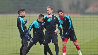 Arsenal's Gabriel Paulista, left, Alexis Sanchez, Nacho Monreal and Mikel Arteta during training on Tuesday. They meet Barcelona on Wednesday night at Camp Nou. Reuters / Matthew Childs