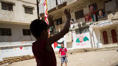 Palestinian refugees from Syria play in the streets of Shatila refugee camp, in Beirut, Lebanon. Andrew McConnell for The National