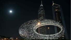 A full moon rises over the Museum of the Future in Dubai. The UAE has defended itself against weeks of Iranian attacks. AFP