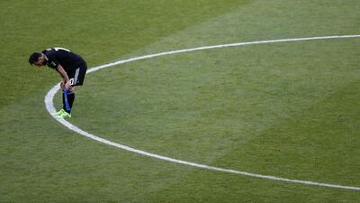 Argentina's Lionel Messi reacts following his teams 1-1 draw. Rebecca Blackwell / AP Photo