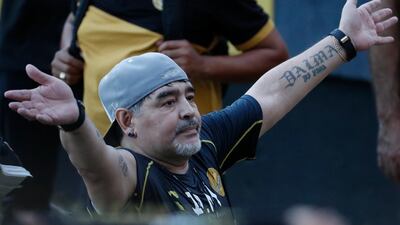 Former soccer great Diego Maradona says goodbye to the fans in stands, after Maradona was presented as the new manager of the Dorados in Culiacan, Mexico. AP