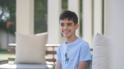 Adam El Rafey, 12, is a freshman at the University of Wollongong in Dubai, the youngest student to ever attend the school. Ruel Pableo / The National