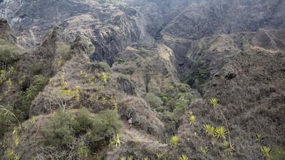 A runner competes in the Grand Raid de la Reunion (also known as The Diagonal of Madmen) ultramarathon race on Friday, October 18, 2019, in the French Indian ocean island of La Reunion. AFP