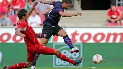 Oliver Giroud, right, who joined Arsenal from Montpellier in the summer, was French Ligue 1's top scorer last season. Friedemann Vogel / Getty Images