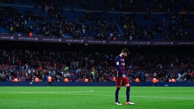 Gerard Pique of FC Barcelona leaves the pitch dejected at the end of the La Liga match between FC Barcelona and Valencia CF at Camp Nou on April 17, 2016 in Barcelona, Spain. (Photo by David Ramos/Getty Images)