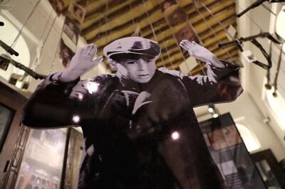 A cardboard cut-out of a Jewish boy is presented at the The We Remember exhibition in Dubai. AP