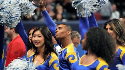 Rams cheerleader Napoleon Jinnies (C) performs with other cheerleaders during Super Bowl LIII between the New England Patriots and the Los Angeles Rams at Mercedes-Benz Stadium in Atlanta, Georgia. AFP