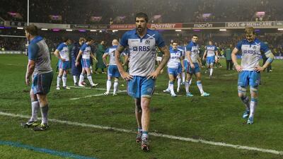 Scotland players walk off the pitch after their loss to South Africa on Sunday. There is no time to sulk beacuse Australia is next. David Rogers / Getty Images