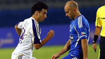 Ignacio Scocco, left, had chances for Al Ain but failed to convert. Mark Bresciano, right, did not miss his opportunity for Al Nasr.