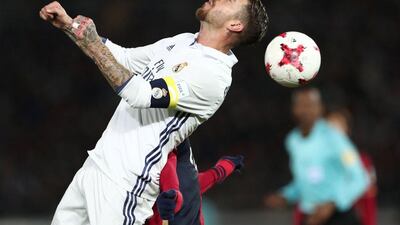 Real Madrid’s Sergio Ramos fights for the ball during the Club World Cup final. Behrouz Mehri / AFP