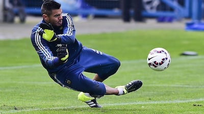 Argentina's Sergio Romero makes a save during Wednesday's training session in Concepcion, Chile ahead of the Copa America final. Luis Acosta / AFP