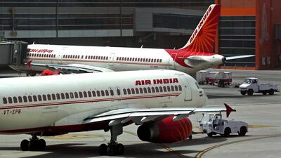 Air India planes are parked on the tarmac at the Indira Gandhi International Airport in New Delhi. AP Photo