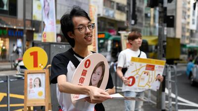 Suporters campaign for Susi Law, a candidate in district council elections in Hong Kong. Reuters