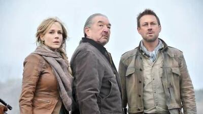 From left, Julie Benz, Graham Greene and Grant Bowler in an episode from Defiance. Ben Mark Holzberg / Syfy / AP Photo