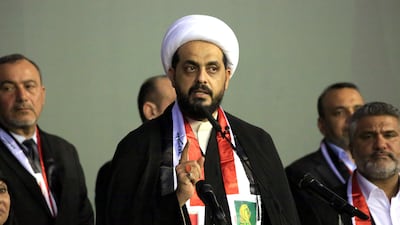 Asaib Ahl Al Haq leader Qais Al Khazali gives a speech. The group is set to hand over its arms to the Iraqi state. EPA
