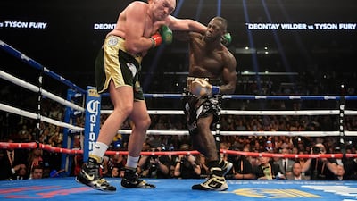 Deontay Wilder connects with Tyson Fury. AP Photo