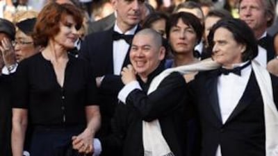 The director Tsai Ming-Liang, centre, arrives at the Cannes showing of Visage with the cast members Fanny Ardant and Jean-Pierre Leaud. "His face has influenced my films a lot," Tsai said of Leaud.