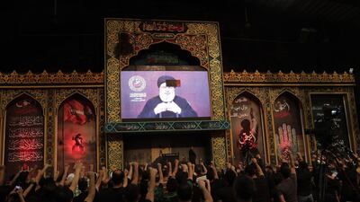 Supporters of Hezbollah gather to watch the transmission on a large screen of a speech by the movement's leader Hassan Nassrallah in Beirut's souther suburbs. AFP
