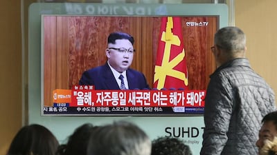 South Koreans at the Seoul Railway Station watch a TV news programme showing North Korean leader Kim Jong-un’s New Year’s speech. Ahn Young-joon / AP Photo