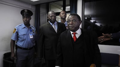 Former army colonel Theoneste Bagosora, right, arrives in court on December 18, 2008, before being convicted on charges of genocide. Photo: AFP