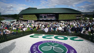 Spectators watching Emma Raducanu in action on centre court from the Hill. PA