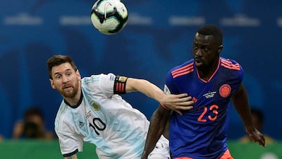 Argentina's Lionel Messi, left, and Colombia's Davinson Sanchez vie for the ball. AFP
